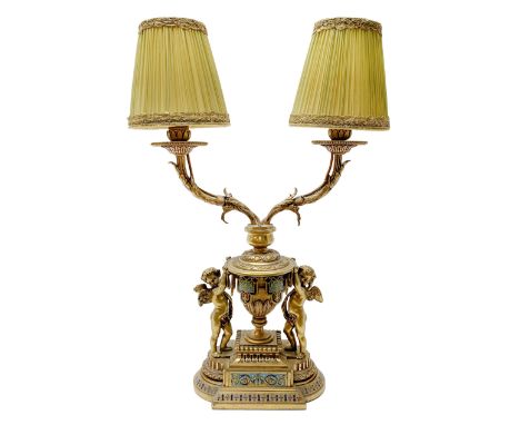 19th century French ormolu and champlevé twin branch table lamp, the stepped plinth base supporting an urn shaped body flanke