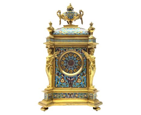 19th century French ormolu and champlevé enamel mantel clock, the twin handled urn with fruit and flower cast finial on cushi