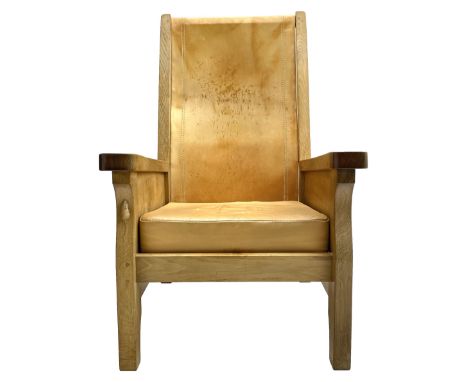 'Mouseman' oak smokers armchair, panelled sides, slung tan leather back and upholstered seat cushion, by Robert Thompson of K