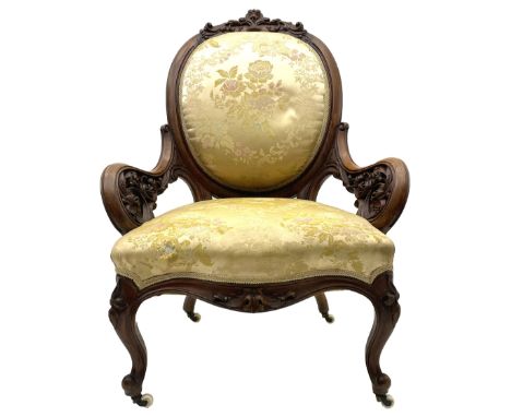 Victorian walnut lady’s drawing room chair, the cameo back cresting rail carved with scrolled foliate and central cartouche, 