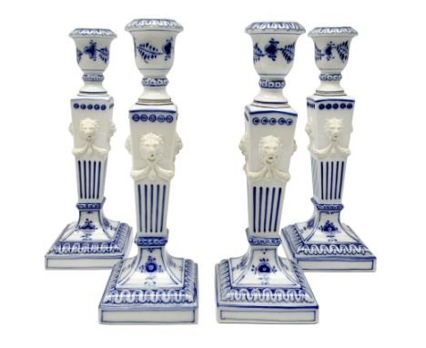 Set of four late 20th century Royal Copenhagen blue fluted candlesticks, of Neoclassical form, the tapering stems with lion m