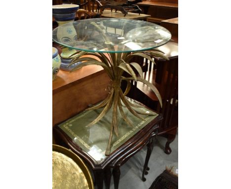 A modern glass top occasional table having gilt metal base in the form of wheatsheaf, diameter approx. 49cm
Some age related 