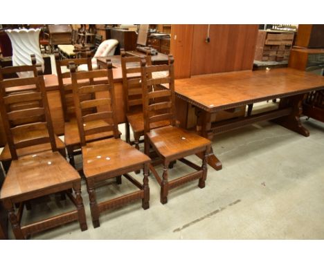 A top quality oak refectory style dining table and set of six ladder back chairs in the period style, by Nigel Griffiths of M