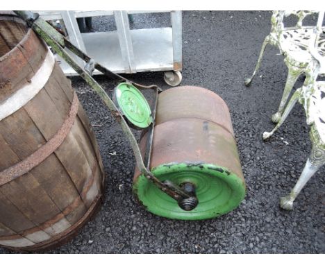 A vintage cast iron garden roller