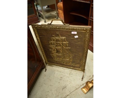 A brass firescreen with galleon design