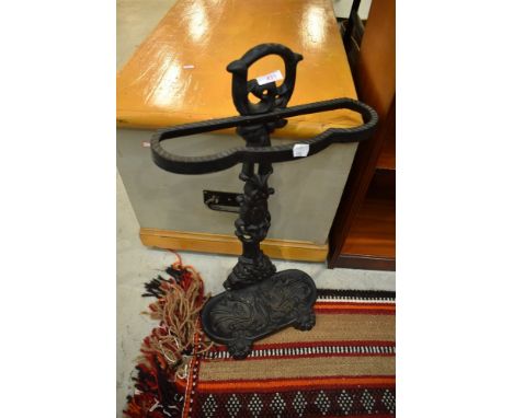 A reproduction cast stick stand