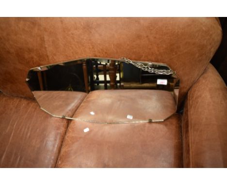 A vintage frameless wall mirror, width approx. 66cm