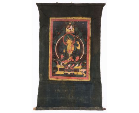 A THANG-KA DEPICTING TARA, TIBET, 19TH CENTURY pigment on cloth, the Buddhist goddess seated on an elaborate throne in lalita