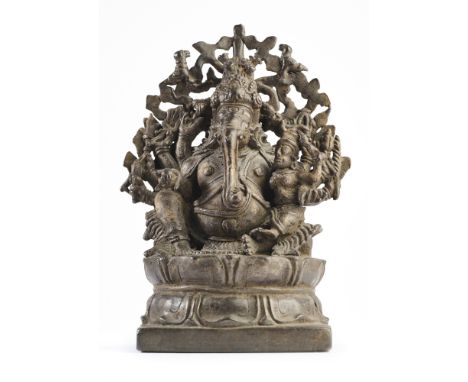 A BRONZE FIGURE OF GANESHA, KERALA, SOUTH INDIA, 15TH/16TH CENTURY  the ten-armed elephant headed deity with pot belly, seate