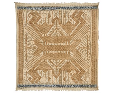 A CEREMONIAL CLOTH (TAMPAN), LAMPUNG, SUMATRA, INDONESIA, 19TH CENTURY woven ochre and indigo cotton, with stylised design of