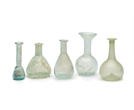 FIVE PALE BLUE AND GREEN GLASS VESSELS, CIRCA 2ND-4TH CENTURY A.D.  including a vessel with bulbous body, mould-blown with ve