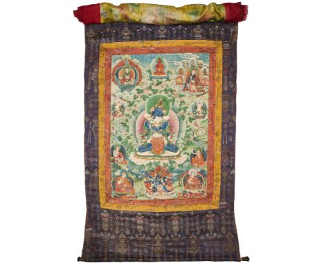 A SINO-TIBETAN THANG-KA DEPICTING VAJRADHARA IN YAB-YUM WITH HIS CONSORT pigment with gold on cloth, the couple in erotic emb