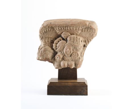 A FRAGMENTARY TERRACOTTA PLAQUE DEPICTING A YAKSHI, BENGAL, 1ST CENTURY B.C.-1ST CENTURY A.D.  with elaborate headdress and j