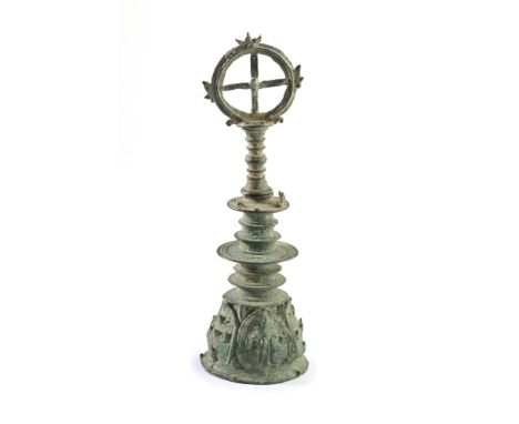 A BRONZE RITUAL BELL, EASTER JAVA, INDONESIA, CIRCA 14TH CENTURY  the handle with protruding disc ridges, the dome with leaf 