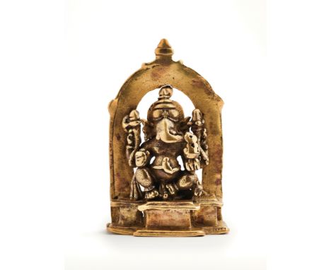 AN EARLY BRONZE FIGURE OF GANESHA, KARNATAKA, CIRCA 12TH / 13TH CENTURY the pot bellied four armed elephant headed deity, sea