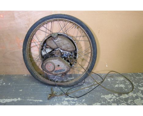 A Cyclemaster Motor Wheel attachmentengine numbered 11252 with cables and petrol tank attached, condition and completeness un