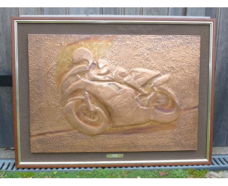 A 'Joey Dunlop' copper reliefapproximately 96.5cm x 72cm, mounted to board and framed, with applied inscribed plaque reading: