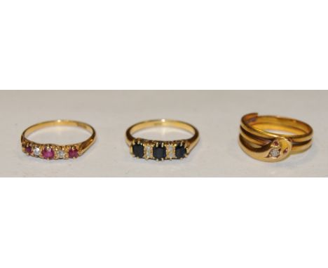 Rings - an Edwardian 18ct gold diamond inset snake ring, ruby eyes, Birmingham 1905, size Q ; a diamond and ruby quintet line