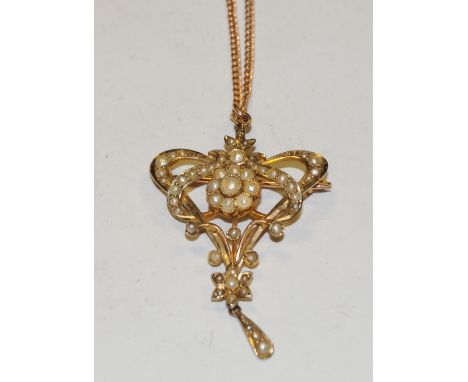 A Edwardian Art Nouveau seed pearl swag heart pendant necklace, open sinuous heart body encrusted throughout with seed pearls