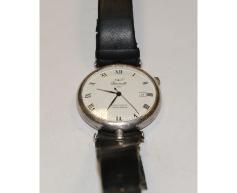 A J &amp; T Windmill silver cased wristwatch, white dial, Roman numerals, centre seconds, date aperture, manual wind 17 jewel