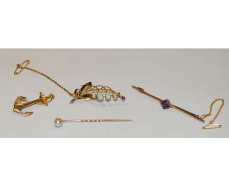A 15ct gold brooch in the form of stylised branch set with opals and ruby 3.6g; a 9ct gold brooch in the form of an anchor 1.