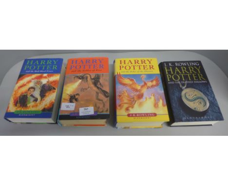 Four Harry Potter books; three first editions, one early edition 