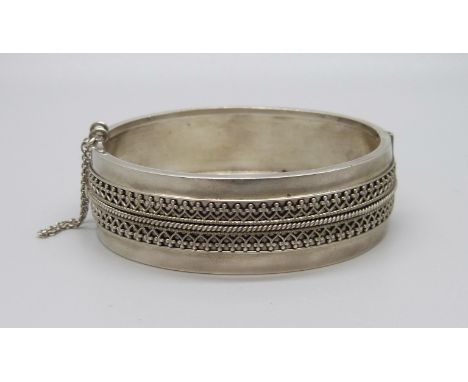 A Victorian hinged bangle, tests as silver 