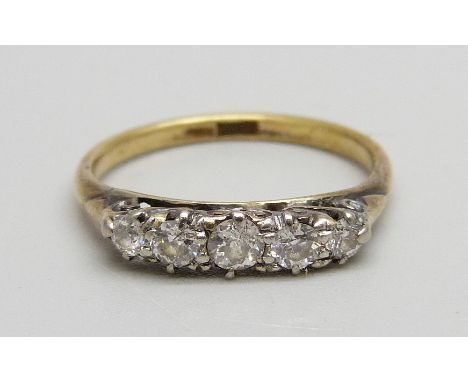 An 18ct gold ring set with five diamonds, 2.8g, N 