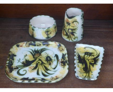Four items of Celtic Pottery; a plate, dish and jug decorated with the cockerel design and a bowl 