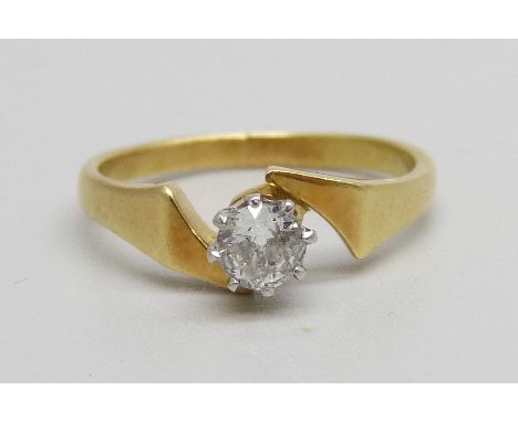 A yellow metal and diamond solitaire ring, 3.1g, L 