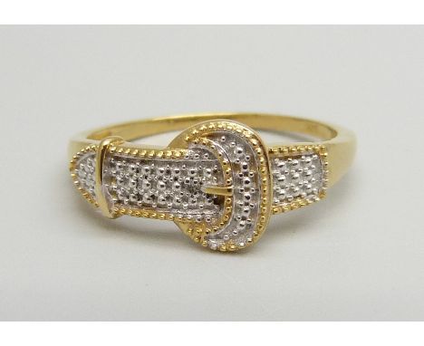A silver gilt buckle ring with a single diamond accent, T 
