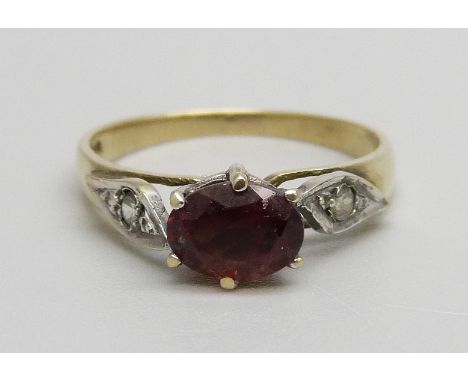 A 9ct gold, garnet and white stone ring, 1.8g, M 