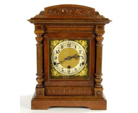 A GERMAN WALNUT ARCHITECTURAL CASED BRACKET CLOCK, THE BRASS DIAL WITH MATTED CENTRE AND PARTLY GILT SILVERED CHAPTER RING, T