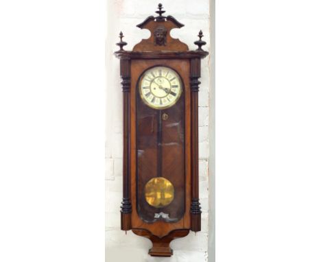 A WALNUT VIENNA WALL CLOCK, WITH PRIMROSE ENAMEL DIAL, ORIGINAL BRASS SLEEVED WEIGHTS, 120CM H, C1900