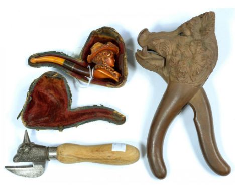 A SWISS CARVED LIMEWOOD BOAR'S HEAD NUT CRACKER, 21CM H, CIRCA EARLY 20TH C, A CARVED MEERSCHAUM LADY'S HEAD CHEROOT HOLDER, 