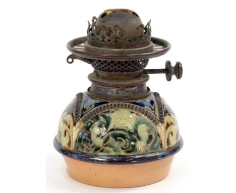 A DOULTONWARE OIL LAMP FOUNT BY MARK V MARSHALL, SGRAFFITO DECORATED WITH MONSTERS AND MASKS, ORIGINAL HINKS & SONS BRASS BUR