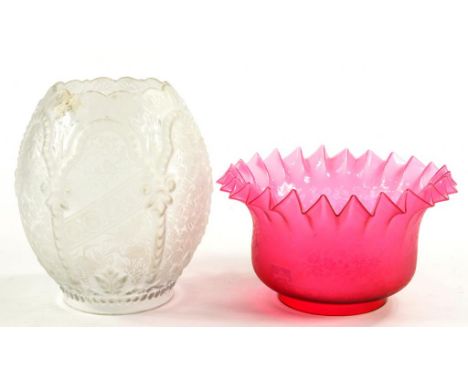 AN ETCHED SATIN GLASS OIL LAMP SHADE, WITH FRILLED RIM, 21CM D AND AN ETCHED AND MOULDED GLASS OVIFORM OIL LAMP SHADE, BOTH C