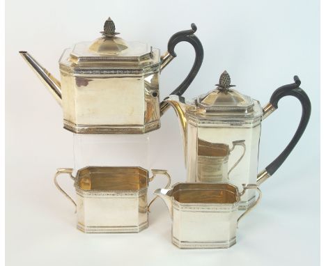 A four piece silver tea service by Roberts and Belk Limited, Sheffield 1925, of rectangular form with canted corners, a band 