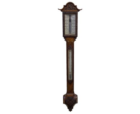 A Victorian walnut barometer and thermometer maker H Blackwood, 251 Sauchiehall Street, Glasgow, in a foliate carved case, 11