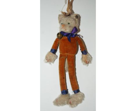 An early Steiff cat with stitched nose and mouth, red stitched claws, white plush and velvet body, with FF button, areas of w