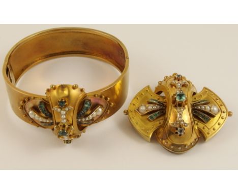 A Victorian brooch and matching bangle the yellow metal balloon brooch is set with pearls and pale green facet cut gemstones 