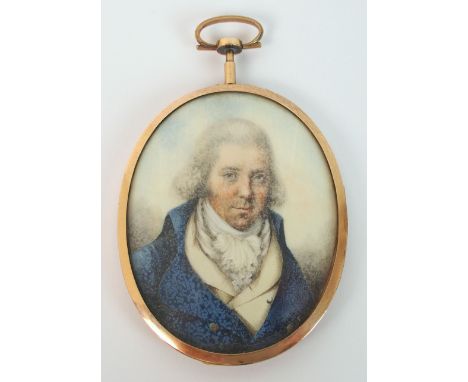 An early 19th Century portrait miniature mourning pendant in gold coloured frame the oval pendant with hand painted miniature