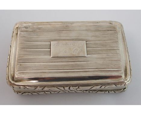 A silver snuff box by Thomas Shaw, Birmingham 1824, of rectangular shape, the hinged cover and body with ribbed decoration an