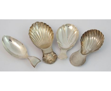 A silver caddy spoon maker's marks DF, London 1918, with shell shaped bowl, 7cm long, with three other caddy spoons, assorted
