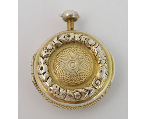 A novelty silver gilt vinaigrette by Samuel Pemberton, Birmingham 1809, modelled as a pocket watch with embossed wreath decor