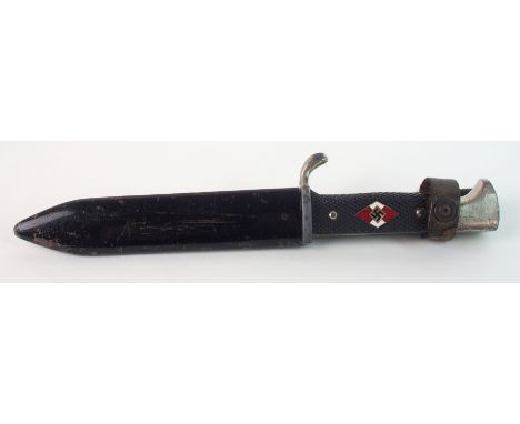 A Second World War Hitler Youth dagger in black metal scabbard the blade marked PUMA SOLINGEN GES. GESCHUTZT and dated 1939, 