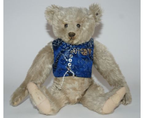 A Steiff Teddy Bear pronounced clipped muzzle, stitched nose, mouth and claws, swivel head, jointed elongated limbs with repa