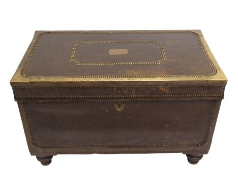 A 19th Century naval camphor wood cabin trunk with leather and brass mounted panels with studded decoration, bail handles and