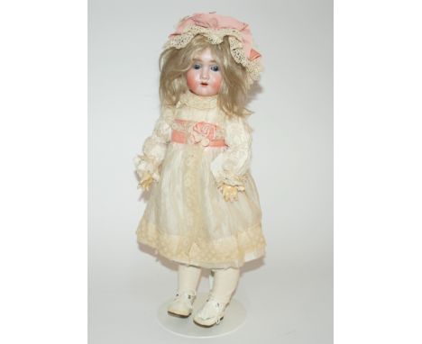 A Handwerck bisque-head doll with open and close blue eyes, open mouth,  and painted features, jointed body, the head impress