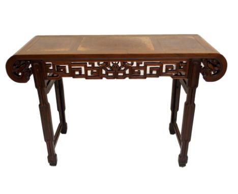 A Chinese hardwood alter table with three burr wood inset panels above a pierced key pattern and animal scroll ends on moulde